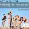 five men standing under a nuclear detonation